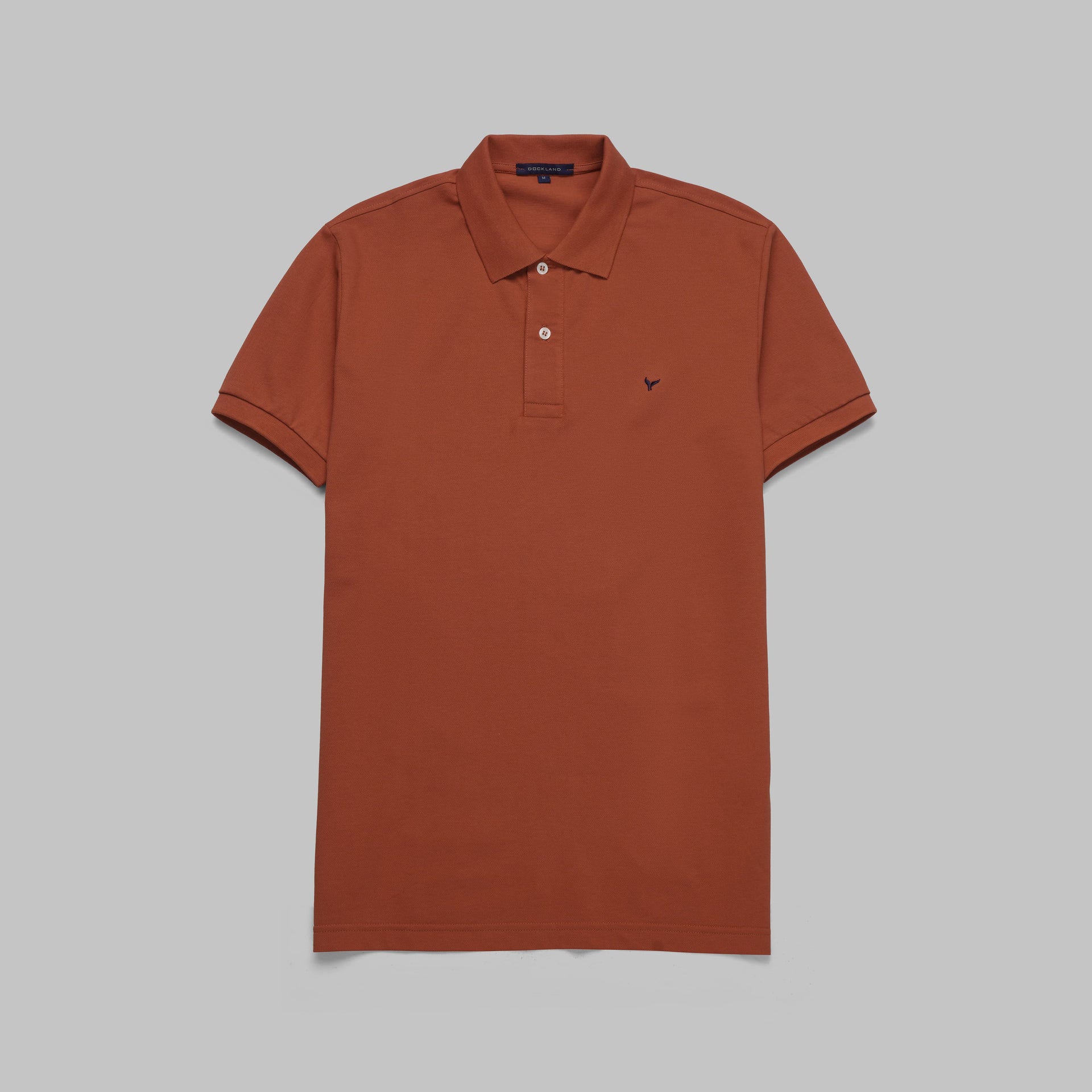 Shop classic fit pique copper polo shirt for men summer 2026 by Dockland - تسوق قميص بولو بيكيه رجالي كلاسيك نحاسي احمر صيفي 2026 من دوكلاند - ملابس رجالي كاجوال صيفي
