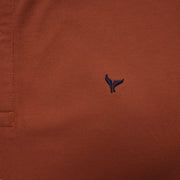 Shop classic fit pique copper polo shirt for men summer 2026 by Dockland - تسوق قميص بولو بيكيه رجالي كلاسيك نحاسي احمر صيفي 2026 من دوكلاند - ملابس رجالي كاجوال صيفي