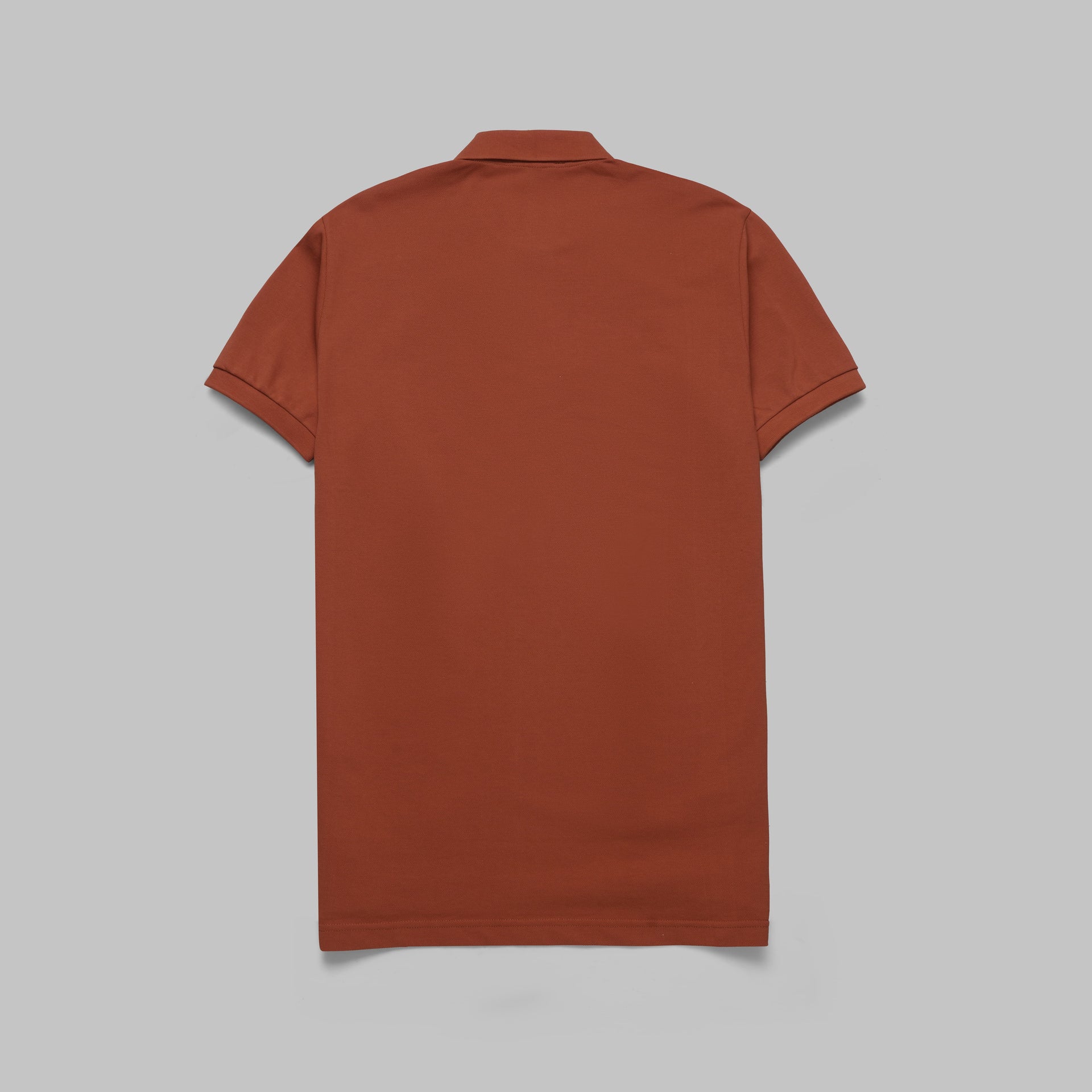 Shop classic fit pique copper polo shirt for men summer 2026 by Dockland - تسوق قميص بولو بيكيه رجالي كلاسيك نحاسي احمر صيفي 2026 من دوكلاند - ملابس رجالي كاجوال صيفي