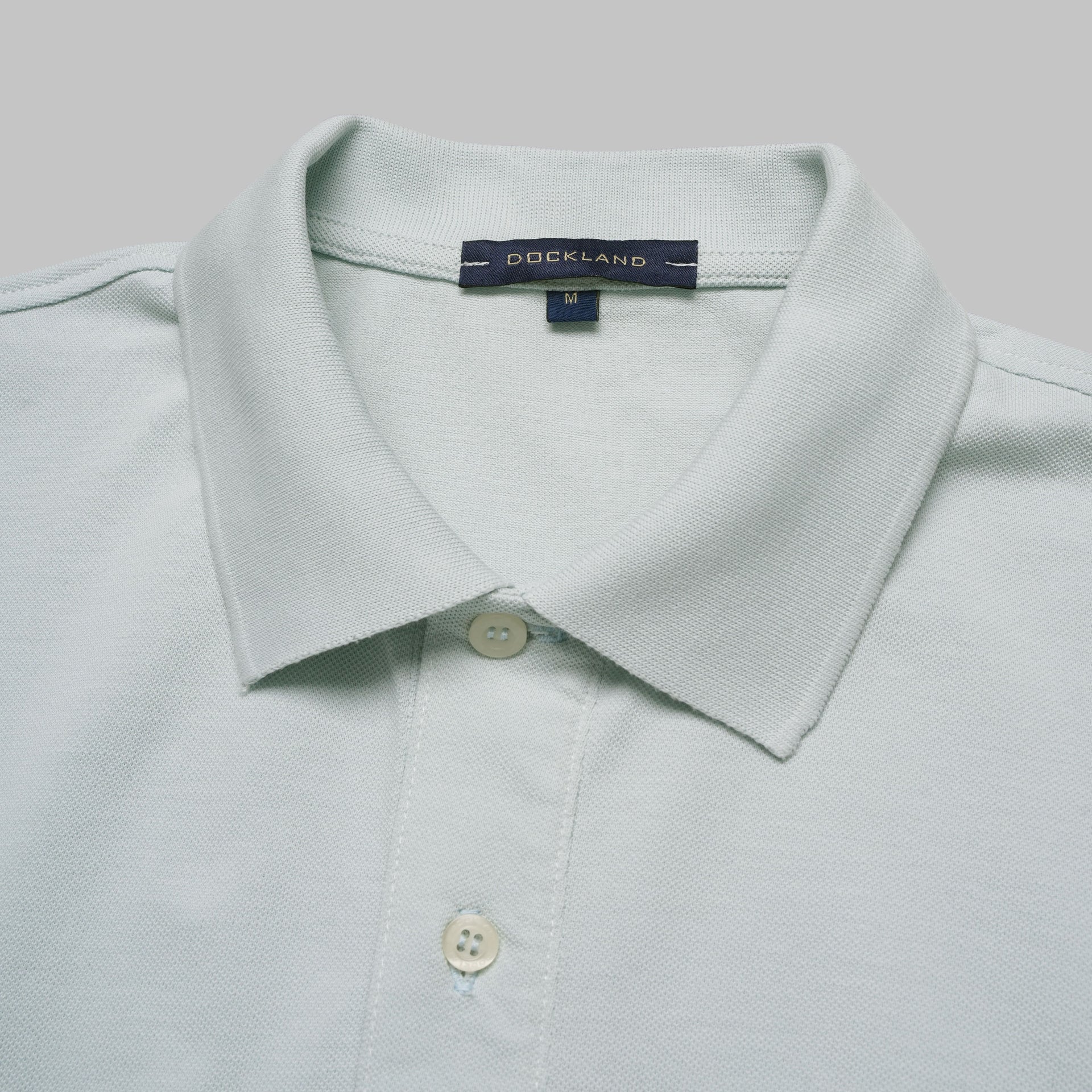 Shop classic fit pique blue polo shirt for men summer 2026 by Dockland - تسوق قميص بولو بيكيه رجالي كلاسيك أزرق سماوي صيفي 2026 من دوكلاند - ملابس رجالي كاجوال صيفي